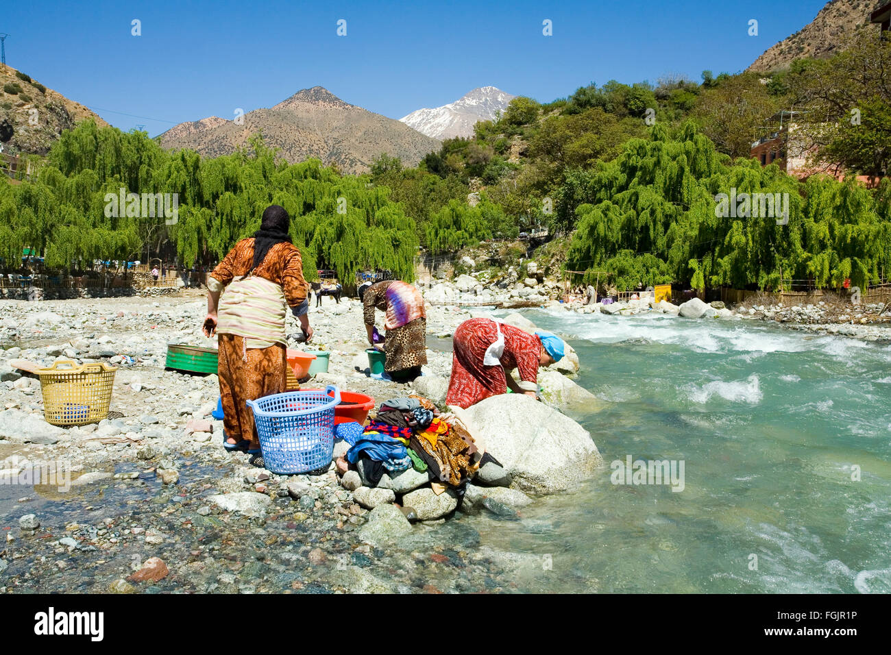 Washing clothes in the river at Setti Fatma, Ourika Valley Morocco Stock Photo