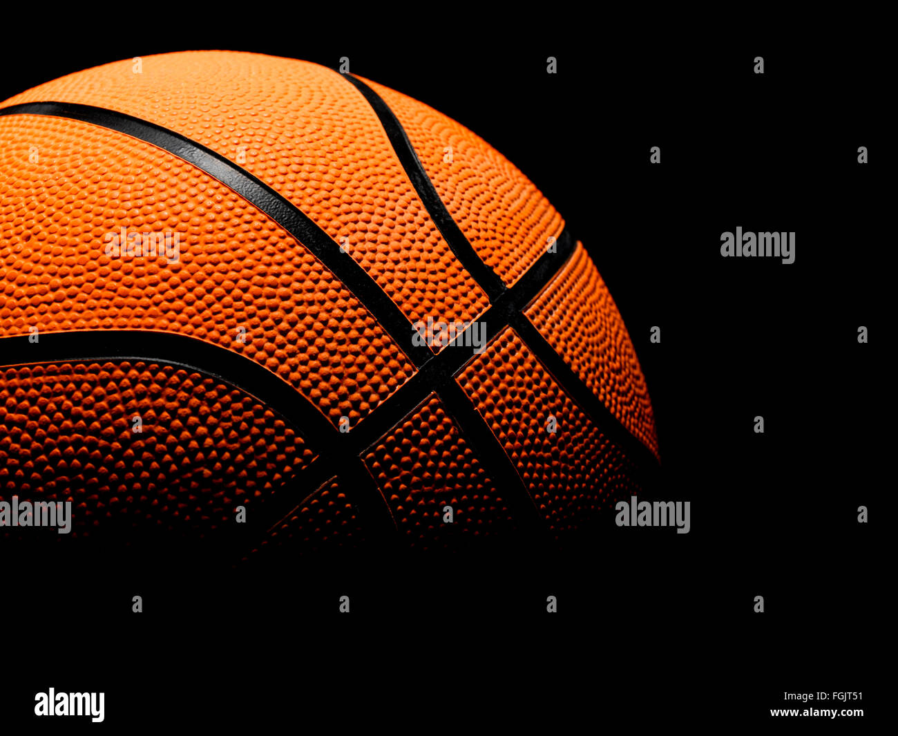 Single Basketball on a black background Stock Photo