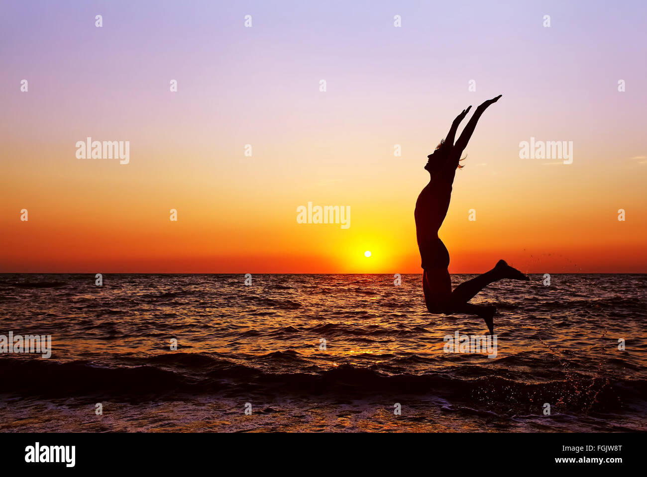 silhouette of a man at sunset Stock Photo - Alamy