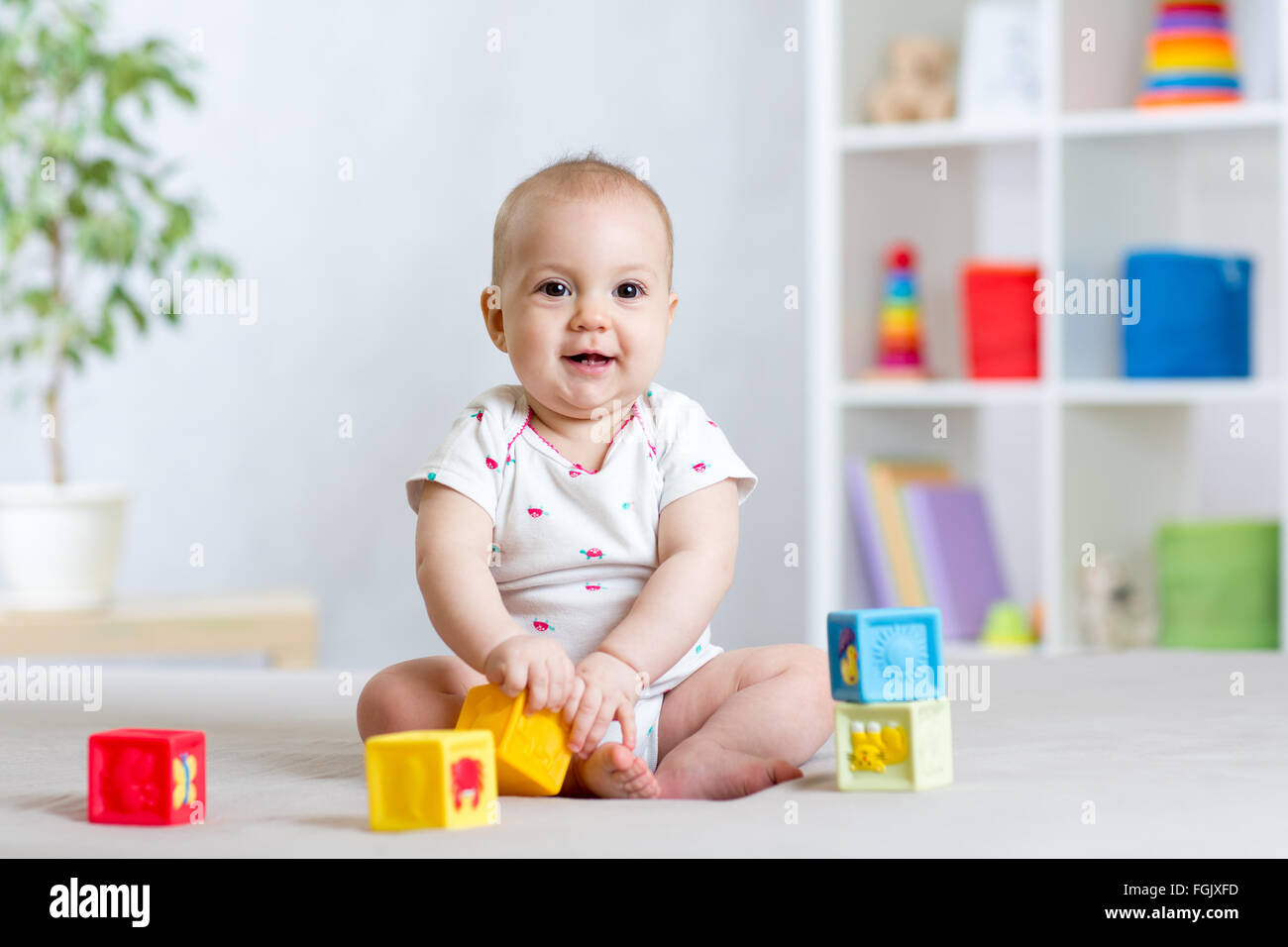 baby playing with building block toys Stock Photo