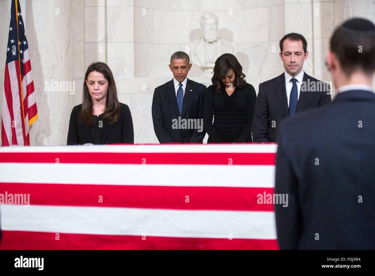 U.S. President Barack Obama and First Lady Michelle Obama pay respect beside the flag draped casket of Supreme Court Justice Antonin Scalia at the Great Hall of the Supreme Court February 17, 2016 in Washington, DC. Scalia died at age 79, during a hunting trip in West Texas. Stock Photo