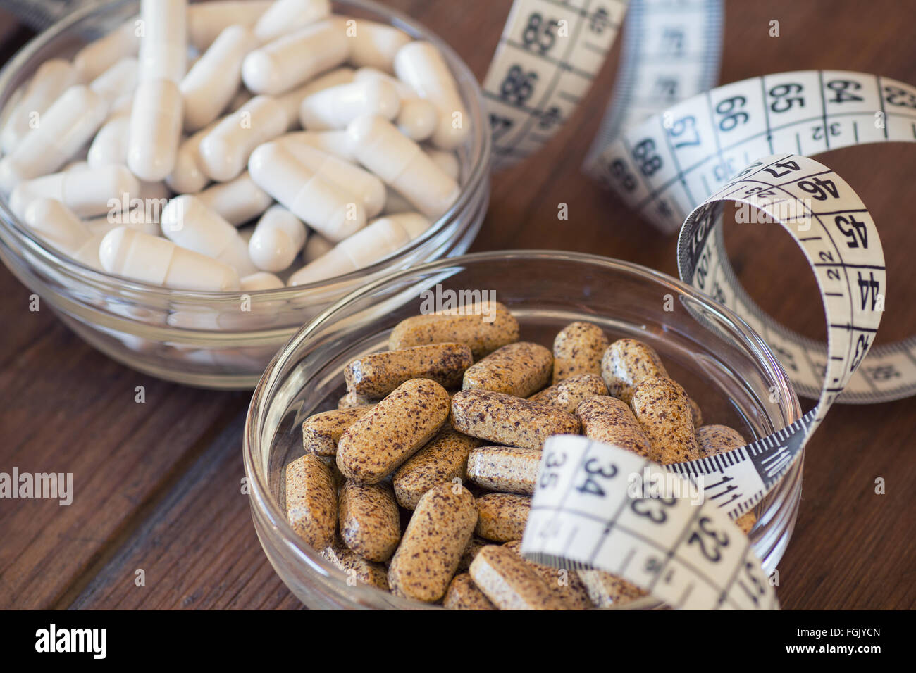 Nutritional supplements in capsules and tablets. Stock Photo