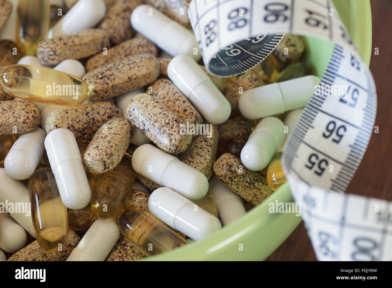 Nutritional supplements in capsules and tablets. Stock Photo