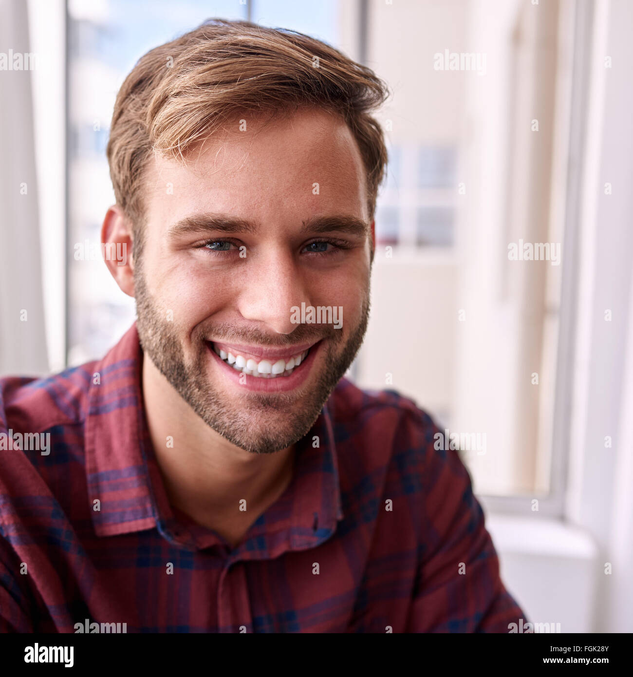 close up square portrait of happy young adult Stock Photo