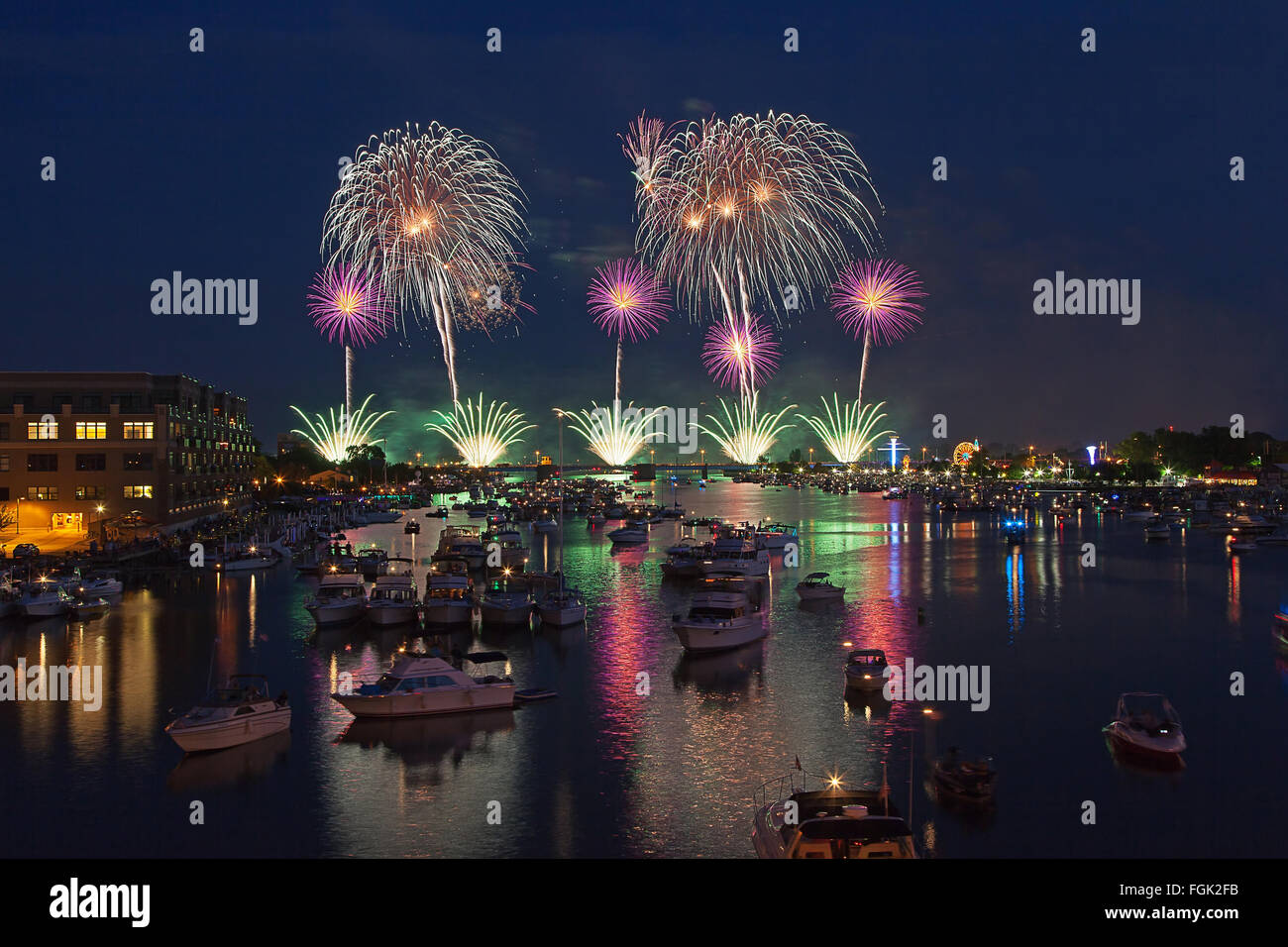 Fireworks explosion reflects in water in Bay City Michigan Stock Photo