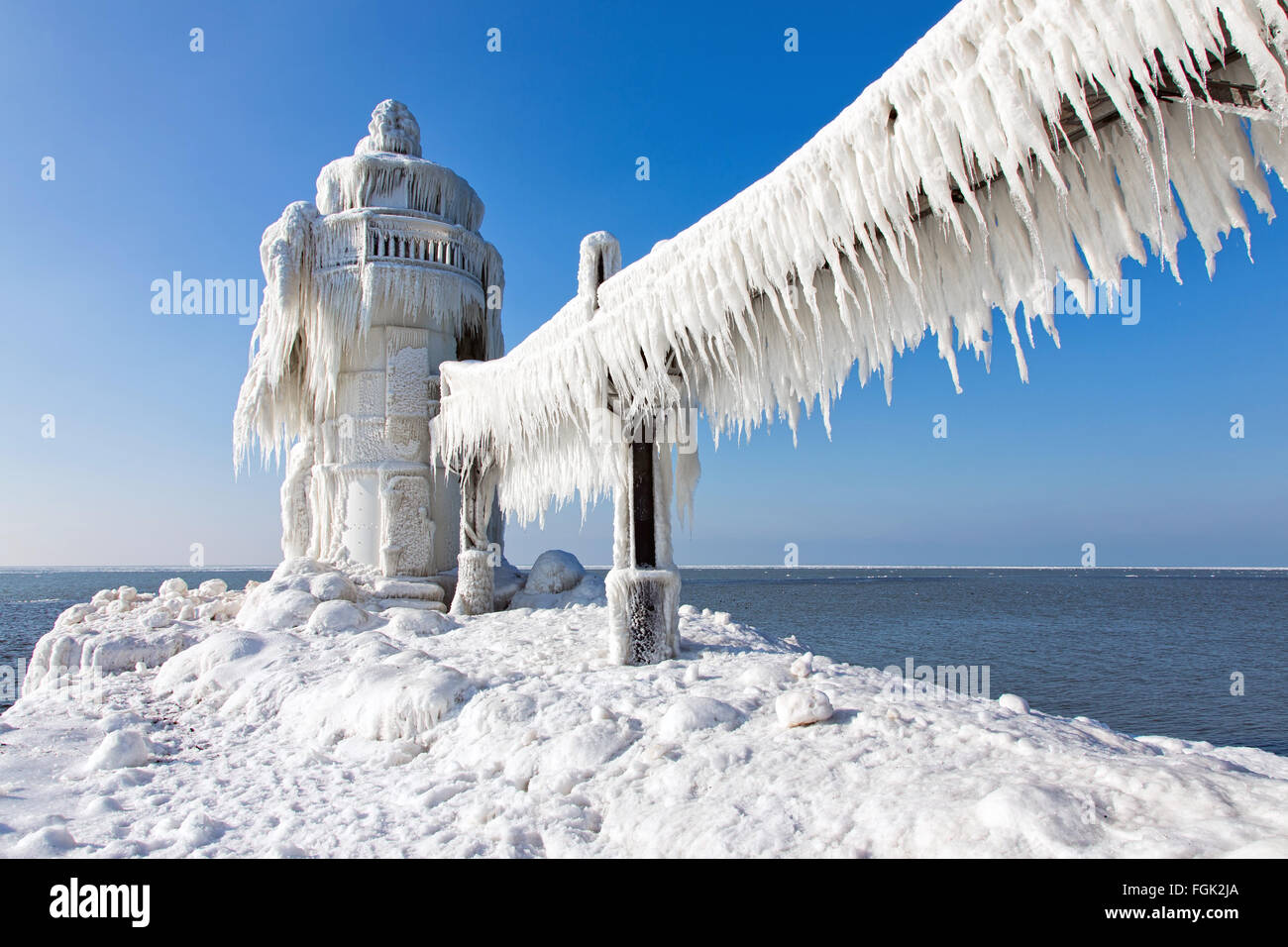 St. Joseph Michigan Lighthouse. North Pier outer lighthouse in St. Joseph Michigan encased in ice in winter Stock Photo