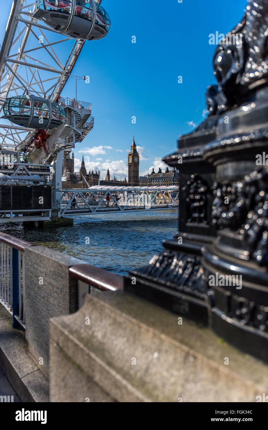 A view of the London eye and Big Ben across the River Thames in the city of London England UK Stock Photo