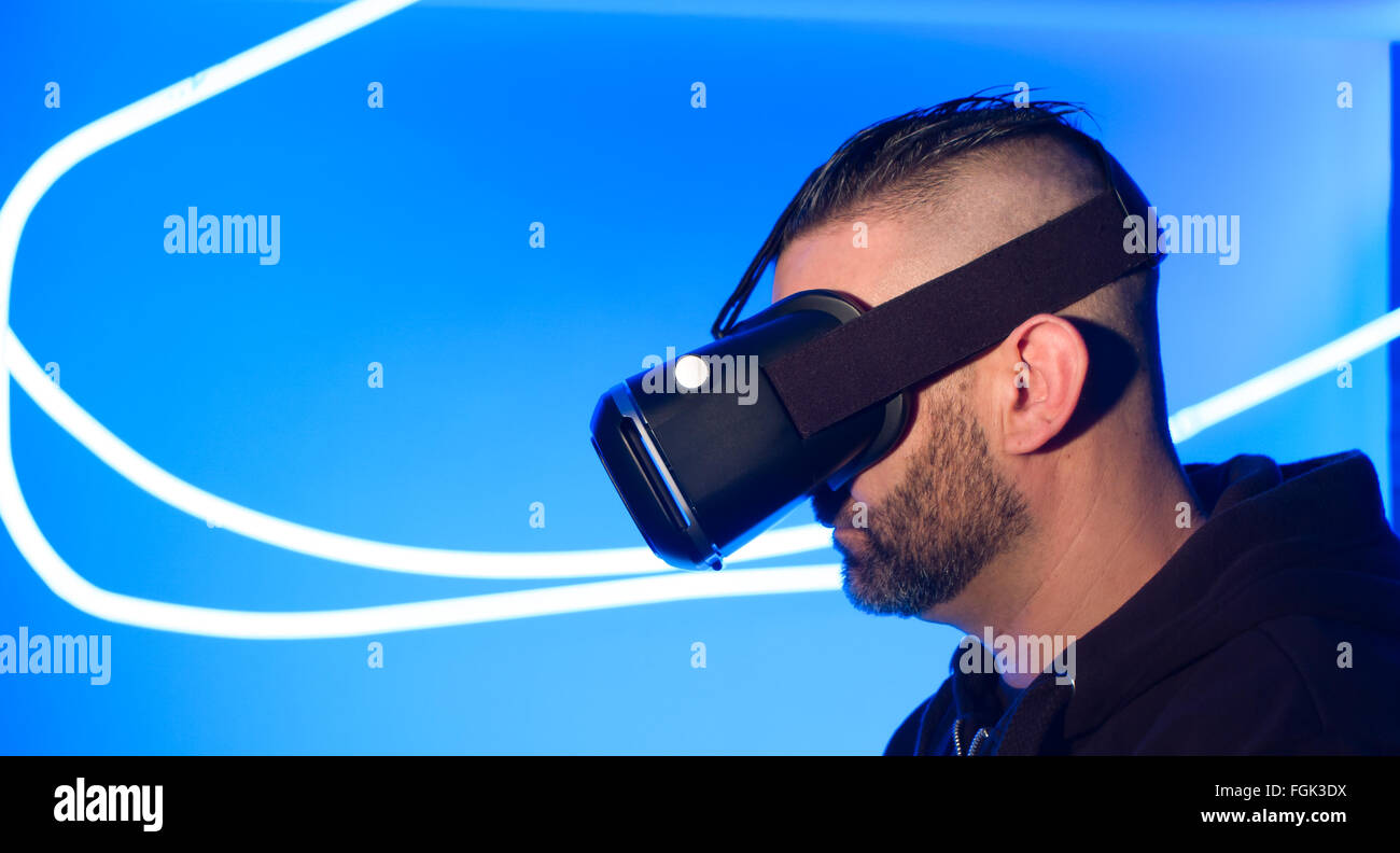 Man Using The Virtual Reality Man using Virtual Reality goggles cyber space Stock Photo - Alamy