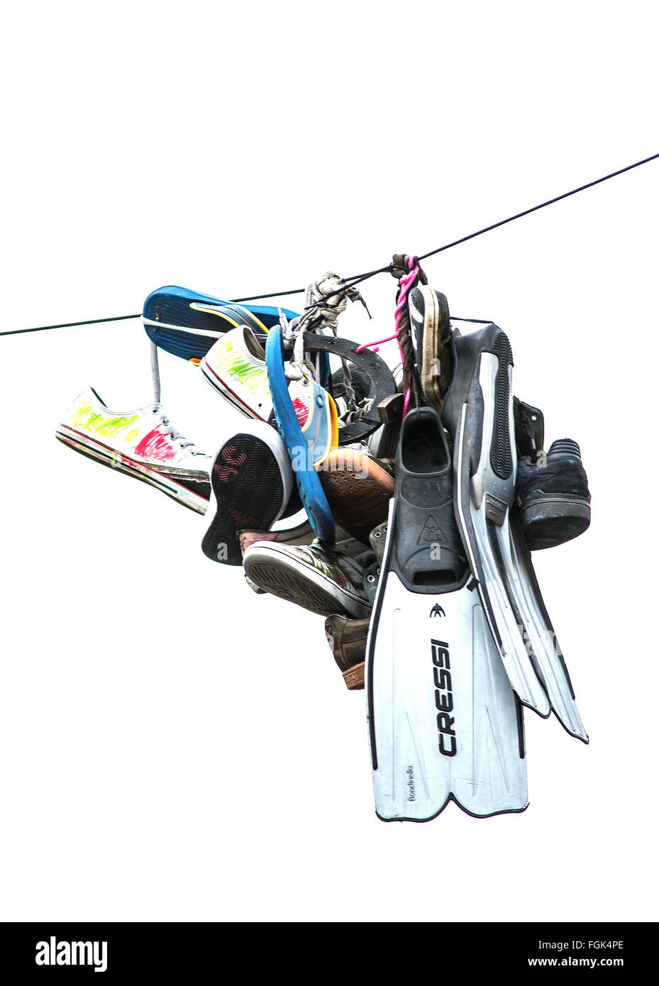 Collection Of Trainers and Flippers hanging from a telephone line Bristol, UK Stock Photo