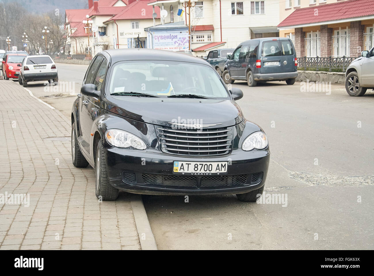 YAREMCHE, UKRAINE - JANUARY 16, 2016: Black Chrysler PT Cruiser at the rural street. Stock Photo