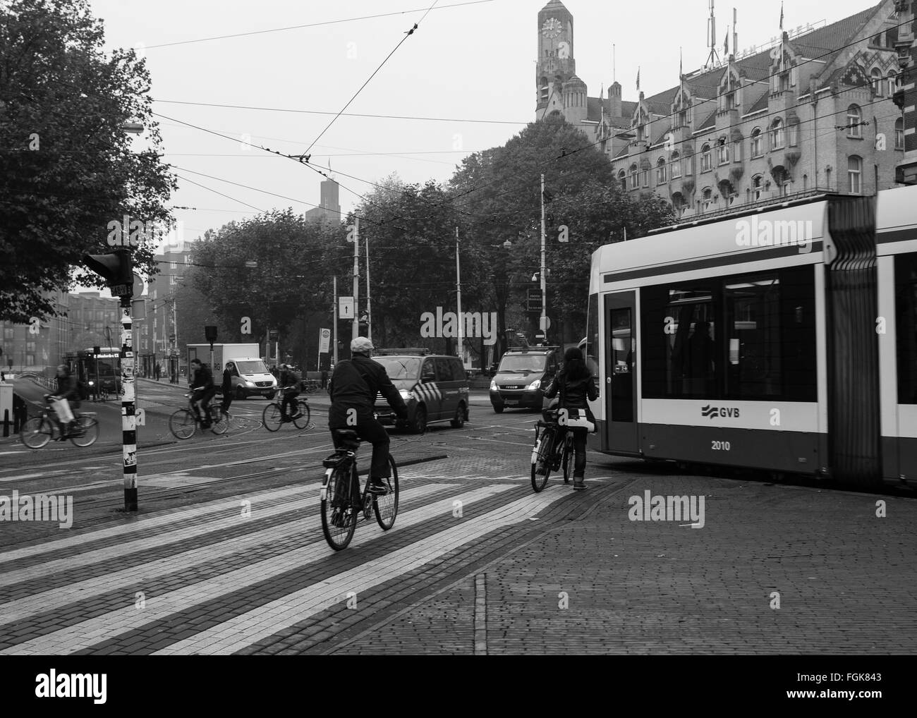 Cars, Trams and cyclists all travel through Leidseplein in Amsterdam Stock Photo