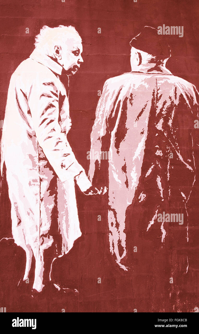 stencil graffito showing an old couple holding hands Stock Photo