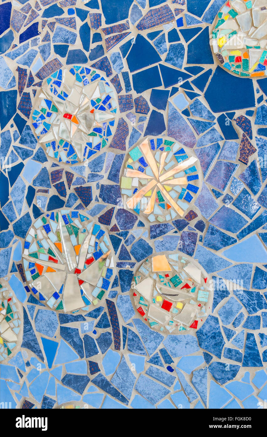 mostly blue tile mosaic with circular forms and color splinters on the facade of a meanwhile torn down building Stock Photo