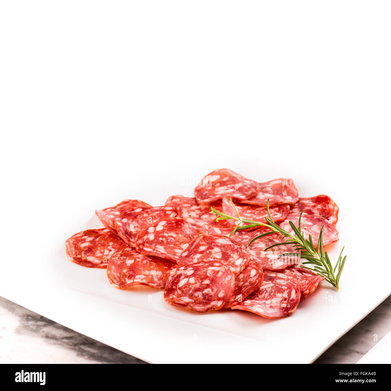 Italian salami with pepper, milan, bratwurst, finely chopped, rosemary, meat, pork, spicy, aroma, spice, tasty, expensive, exclu Stock Photo