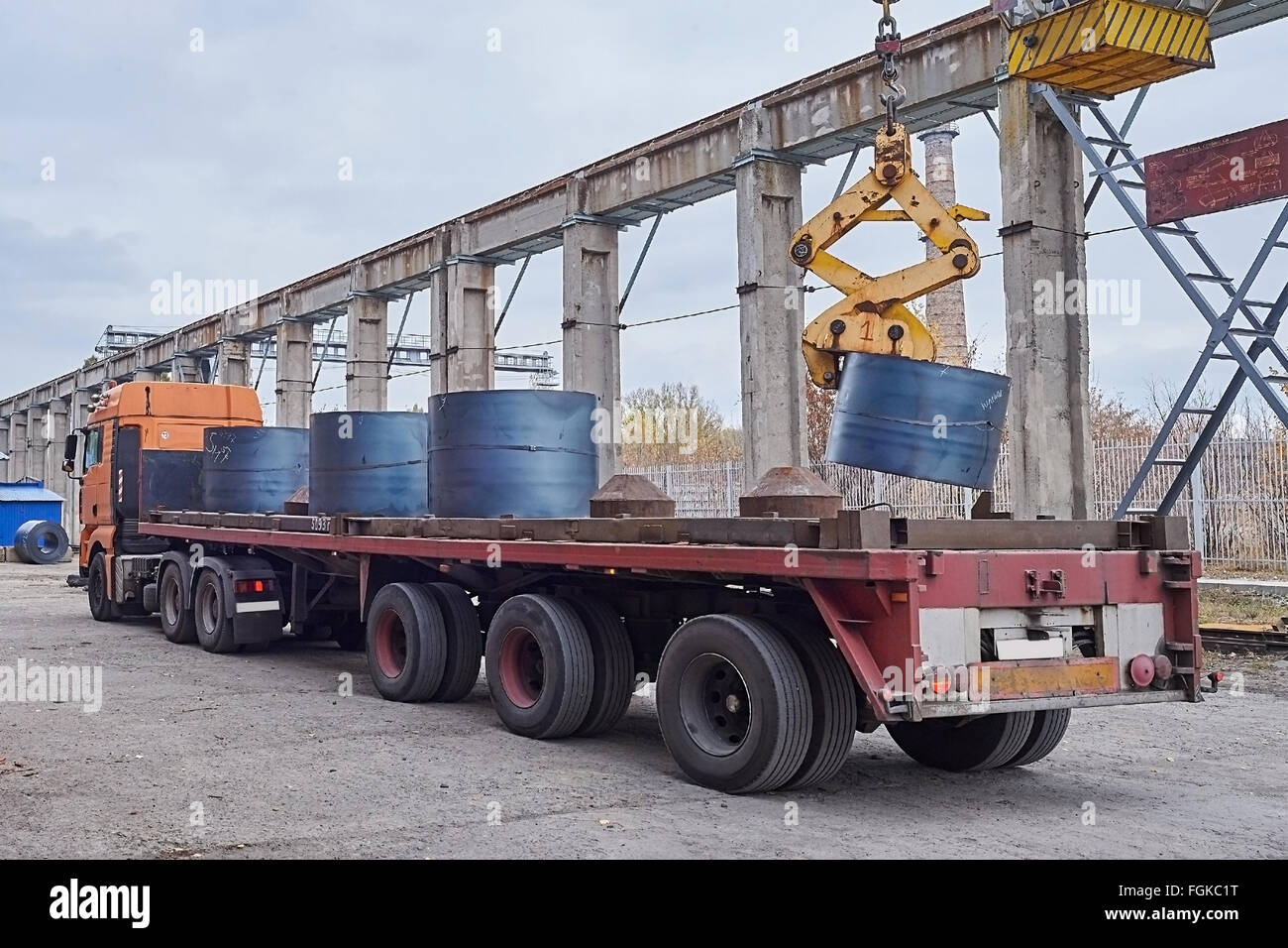 Cranes unloading a freight transport with still rolls Stock Photo - Alamy