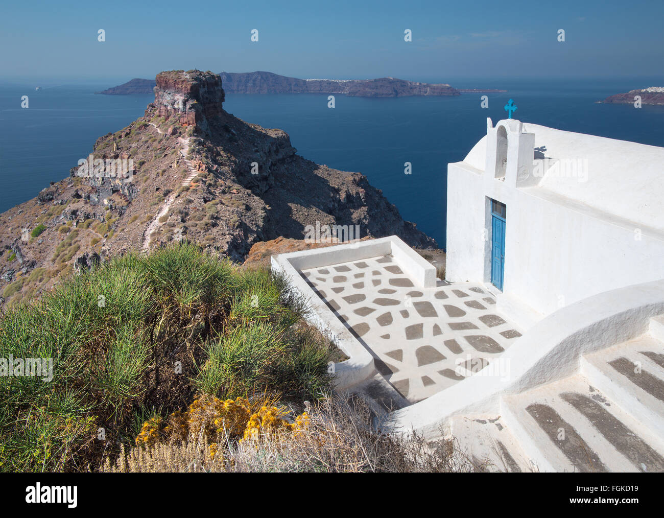 Santorini - The look to typically little church Agios Ioannis Katiforis in  Imerovigli and the Skaros castle Stock Photo - Alamy