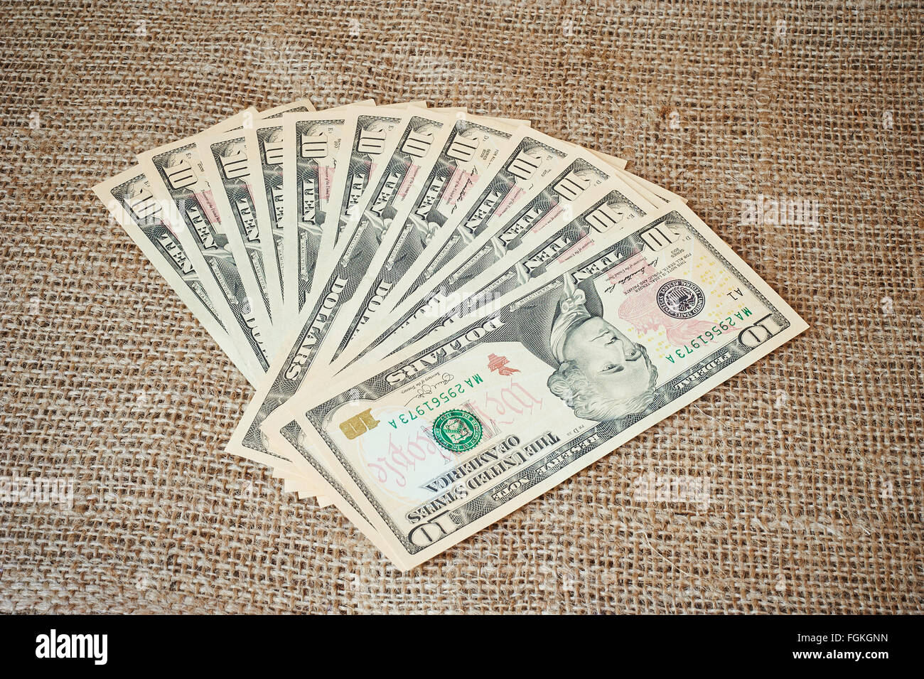 Dollars on a burlap background with place for text Stock Photo