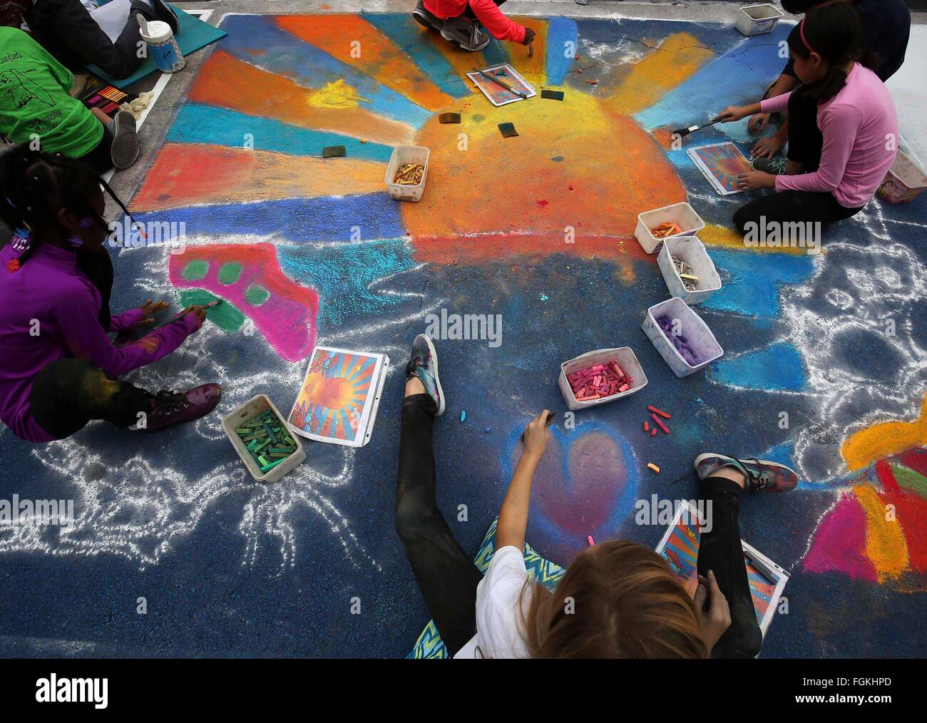 Florida, USA. 20th Feb, 2016. A group of fourth and fifth graders from the Hidden Oaks Elementary School Art Club work on their chalk painting at the Annual Lake Worth Street Painting Festival Saturday, February 20, 2016. ''My budding artists are doing an awesome job, '' said art teacher Lisa Thorschmidt. ''It is one of their favorite things in the year.'' The 2-day event transforms downtown streets with street paintings, covering more area than any other festival of its kind in the U.S. Credit:  Bruce R. Bennett/The Palm Beach Post/ZUMA Wire/Alamy Live News Stock Photo