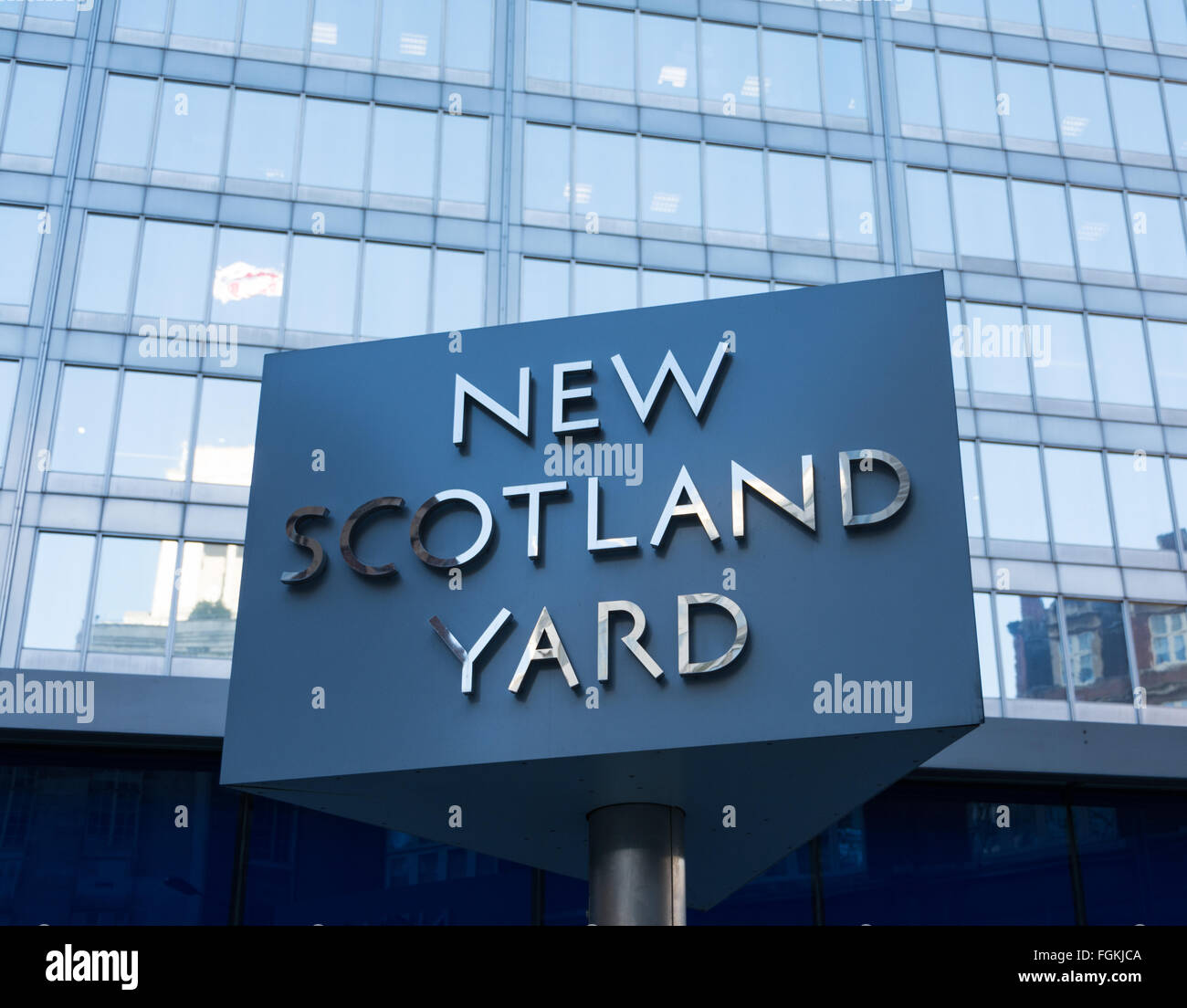 Revolving sign in front of old 'New Scotland Yard' in London, UK Stock Photo