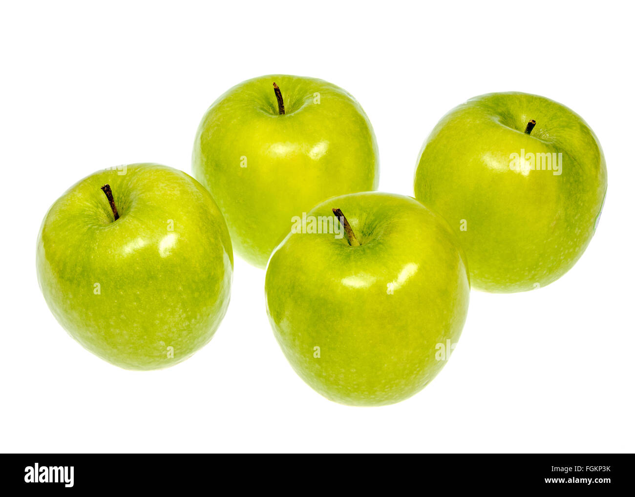 Four green apples on a white background Stock Photo