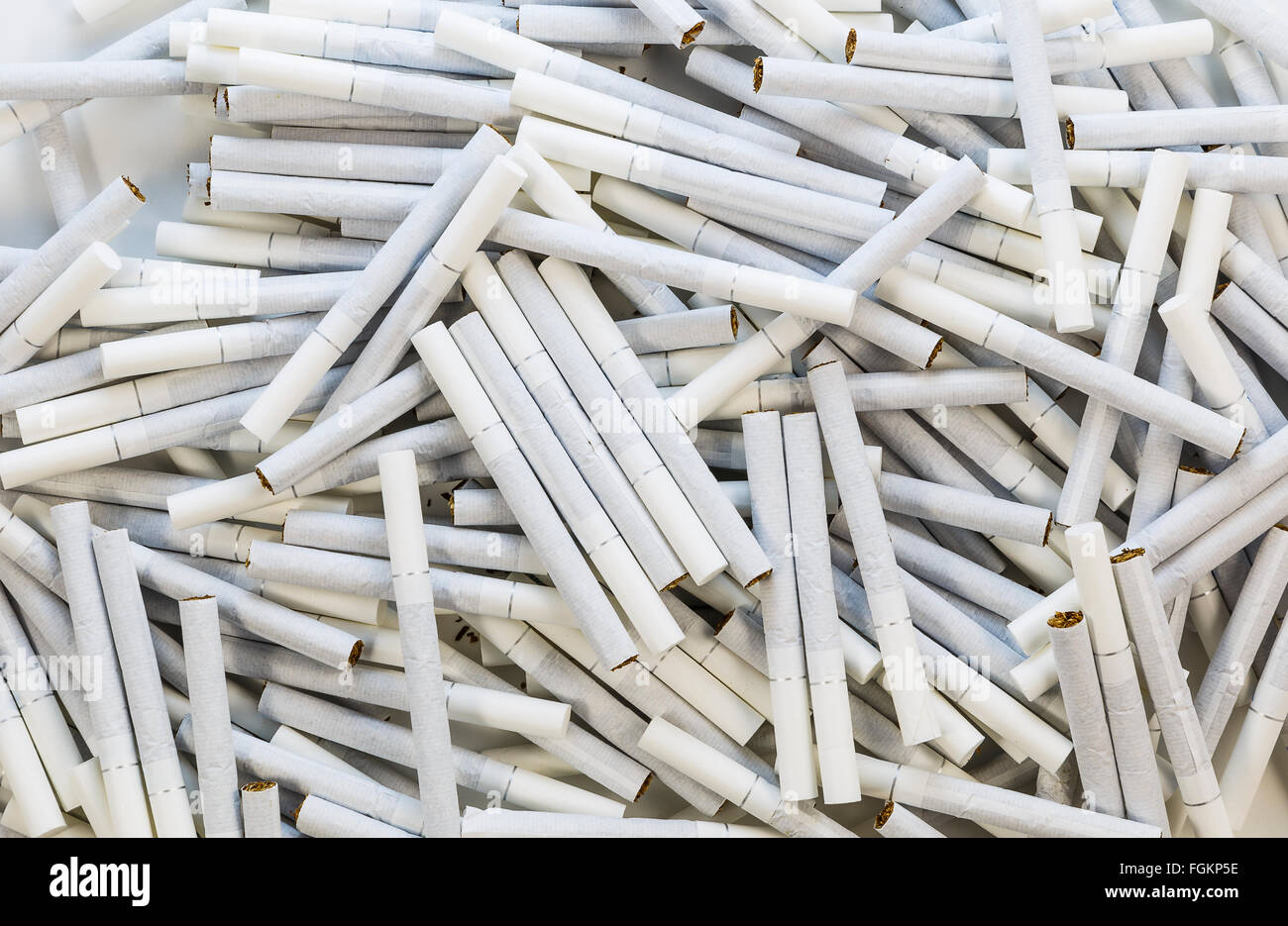 Scattered cigarettes with white filter on the floor Stock Photo Alamy