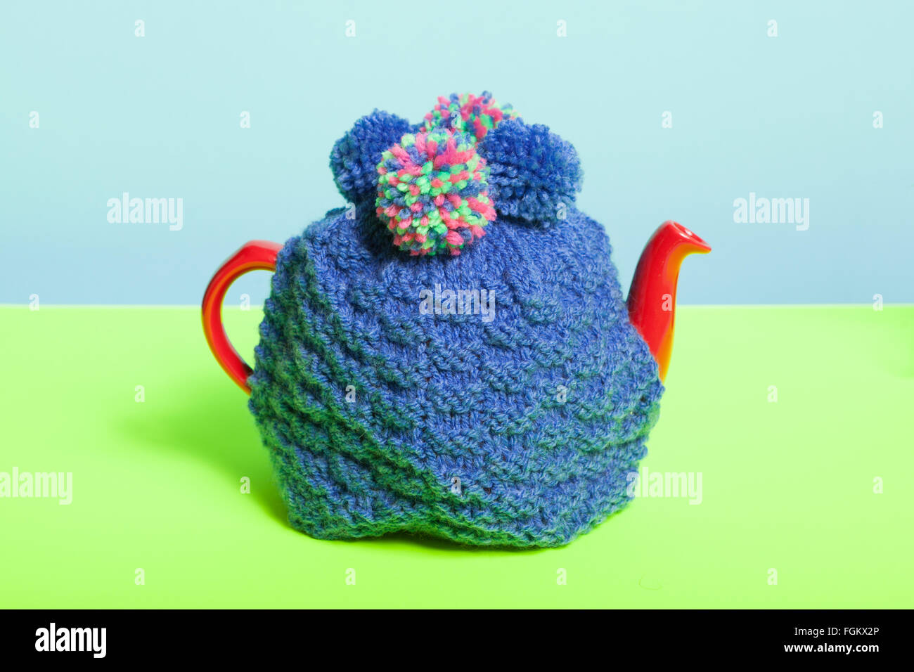 Teapot with knitted cosy Stock Photo