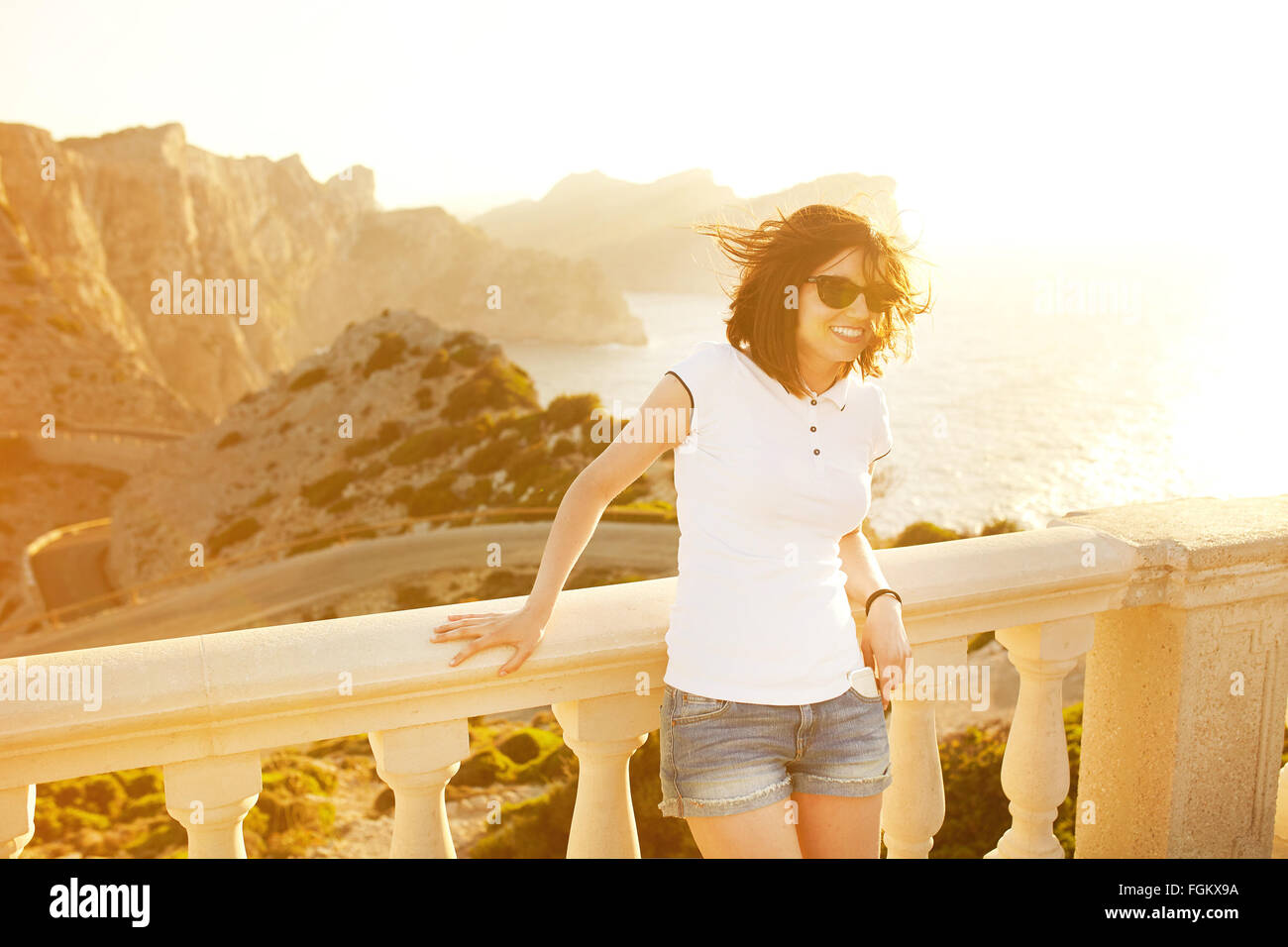 Young smiling woman wearing sunglasses Stock Photo