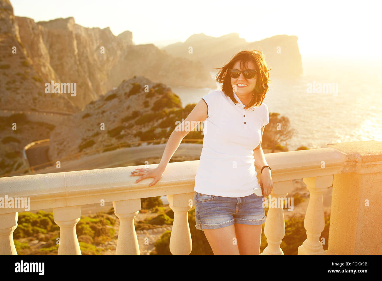Happy girl on sunset at Cap Formentor Stock Photo