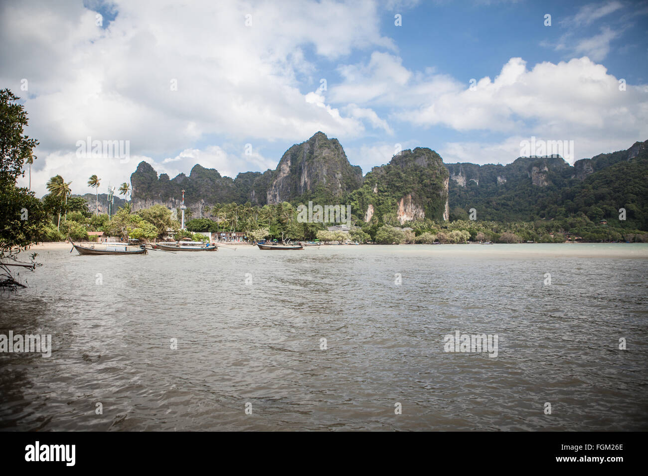Boat and limestone cliffs in Railay, Krabi Province, Thailand Stock Photo