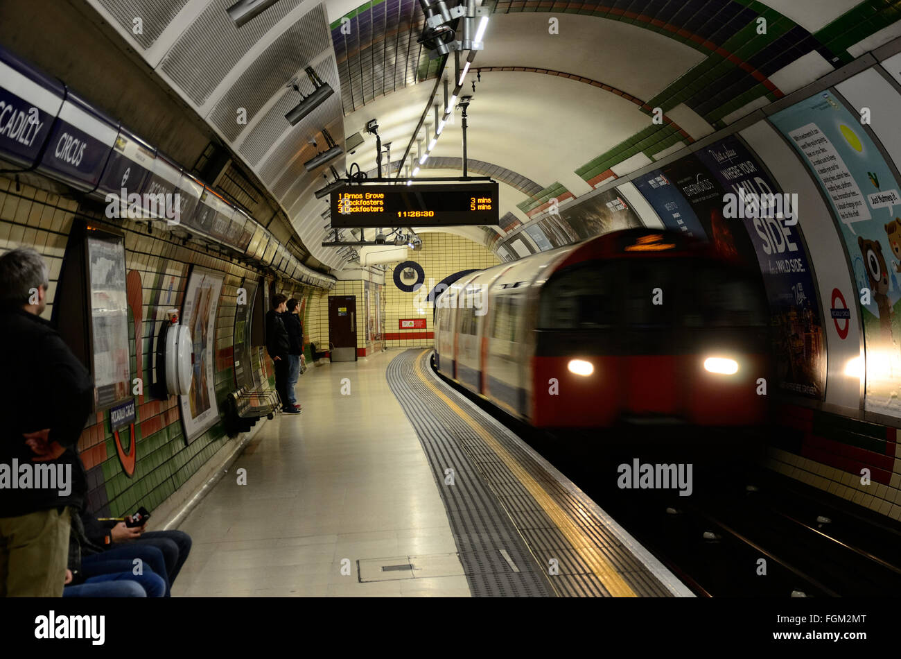 A train arrives into Piccadilly Circus London Underground station on a Saturday morning Stock Photo