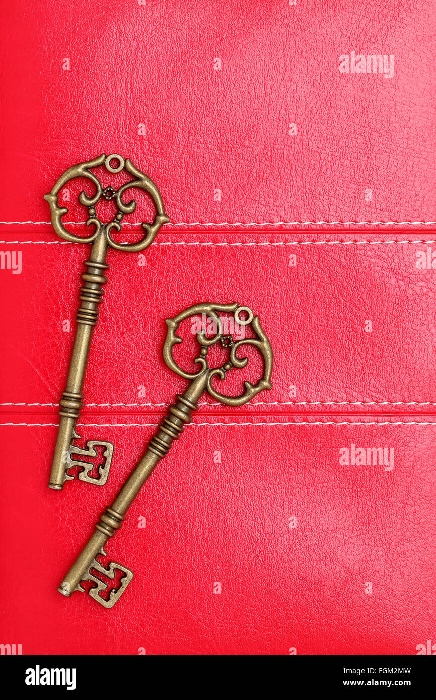 Vintage door key on a leather background Stock Photo Alamy