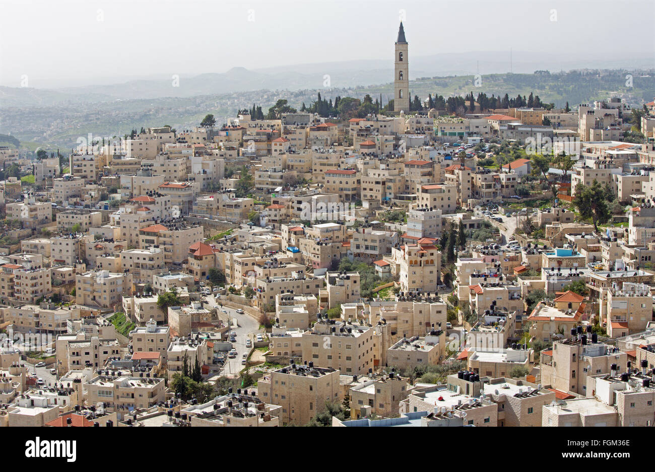 Jerusalem - The Russian orthodox church of Ascension on the Mount of Olives and the ruins of Herodion on the horizon. Stock Photo