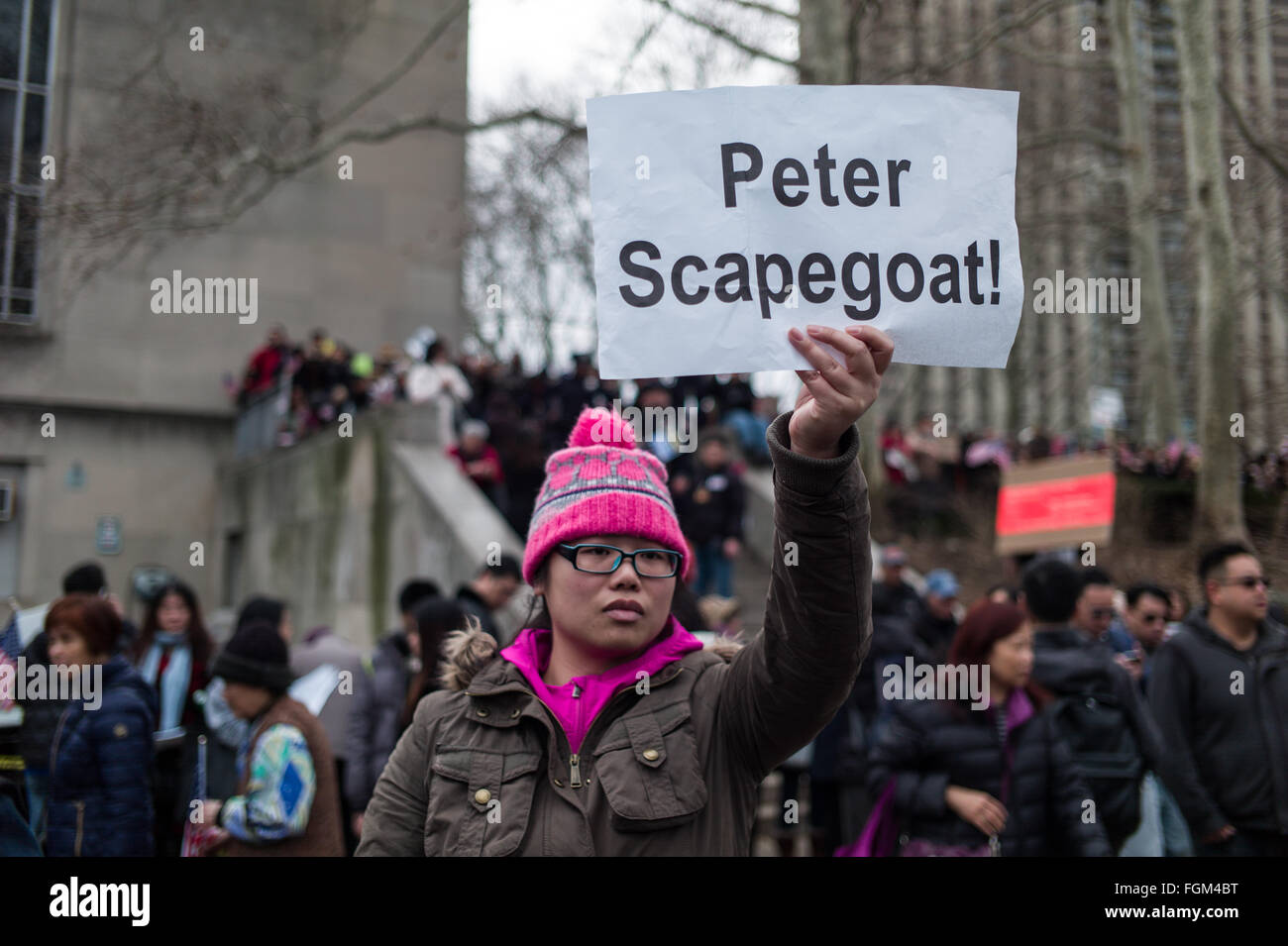 (160221) -- NEW YORK, Feb. 21, 2016 (Xinhua) -- A woman attends a rally in support of New York City Police officer Peter Liang, at Brooklyn's Cadman Plaza Park, in New York, the United States, Feb. 20, 2016. Peter Liang, a New York City police officer of Chinese descent, was found guilty on Feb. 11 of manslaughter over the shooting of a black man, prompting concerns of discrimination. On Nov. 20, 2014, Liang, a 27-year-old with only a year and a half on the job, was patrolling with his partner in Brooklyn's East New York housing project when he was startled by a noise. In a stairway that pro Stock Photo