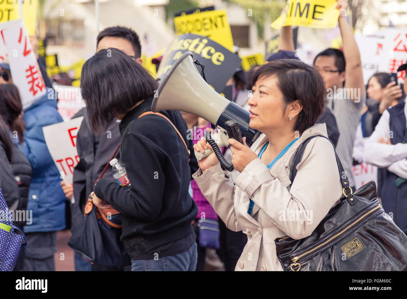 San Francisco, USA. 20th Feb, 2016. Chinese American Female Protester with Megaphone Credit:  Alexander Zhu/Alamy Live News Stock Photo