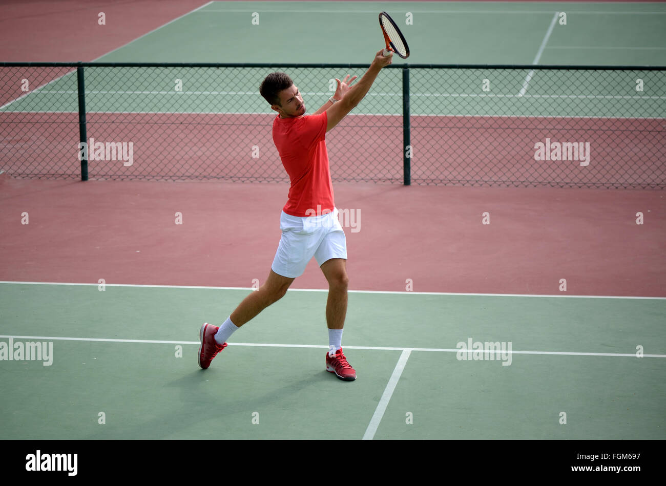 Male tennis player practice in tennis court in Dubai. Stock Photo