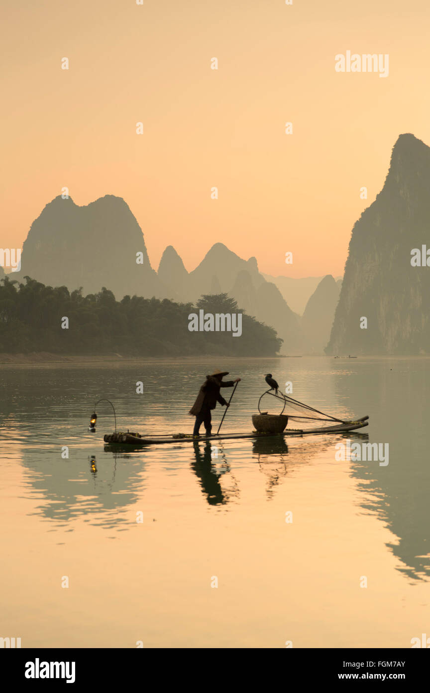 Cormorant fisherman on Li River at dawn, Xingping, Yangshuo, Guangxi, China Stock Photo