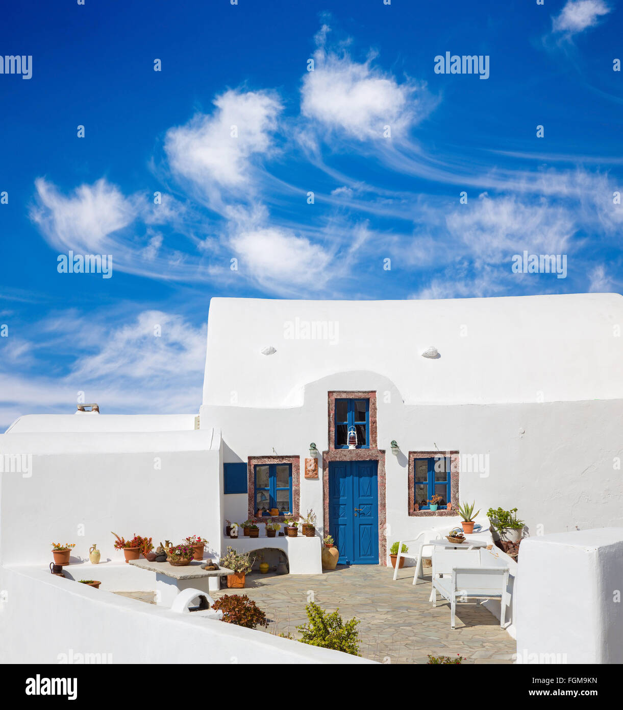 Santorini - The typically little house and yard with he flowers in Oia. Stock Photo