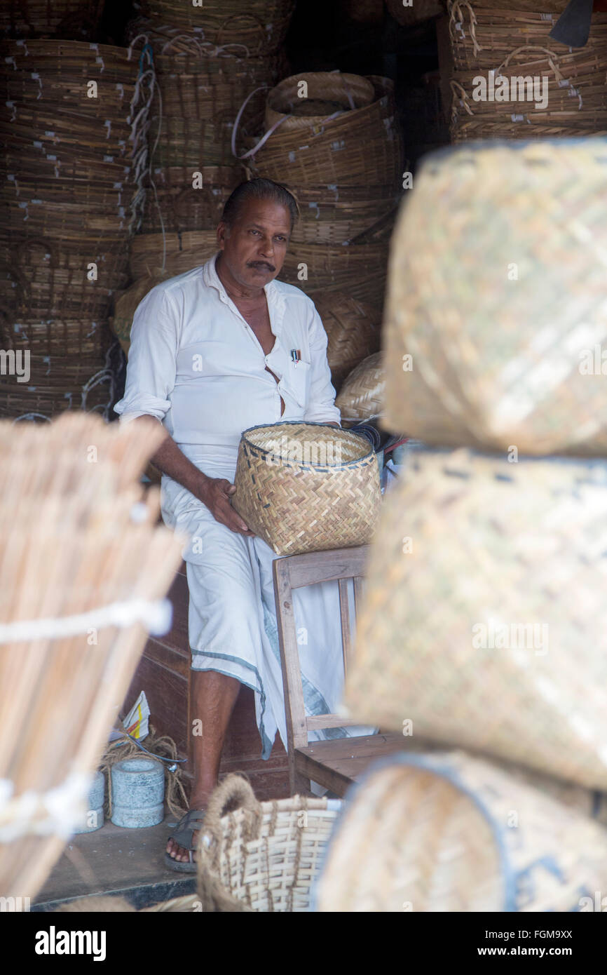 Unidentified bamboo basket maker in Varkala, India. Stock Photo