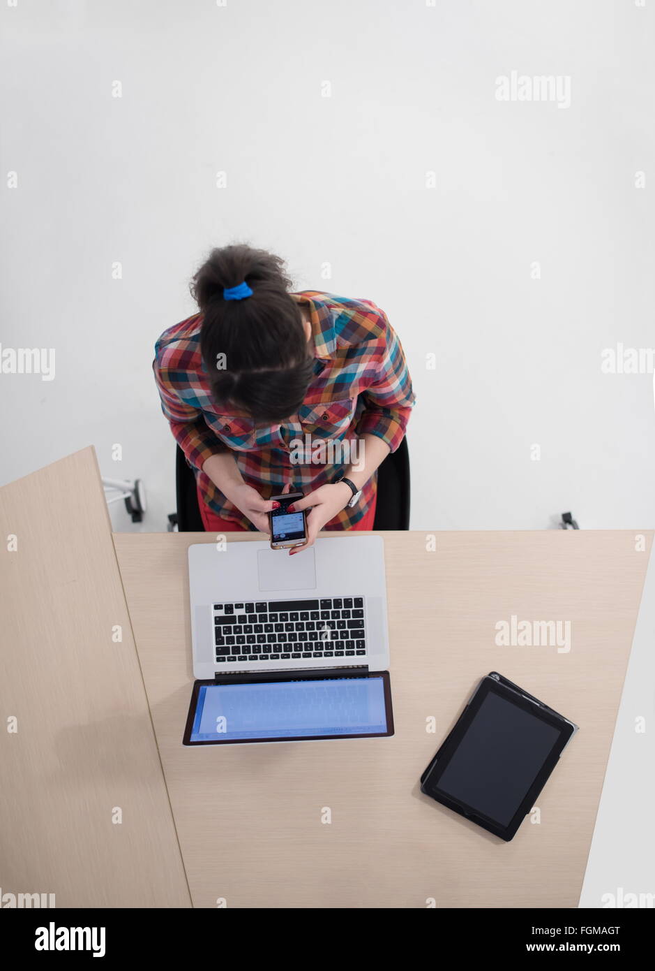 top view of young business woman working on laptop computer in modern ...