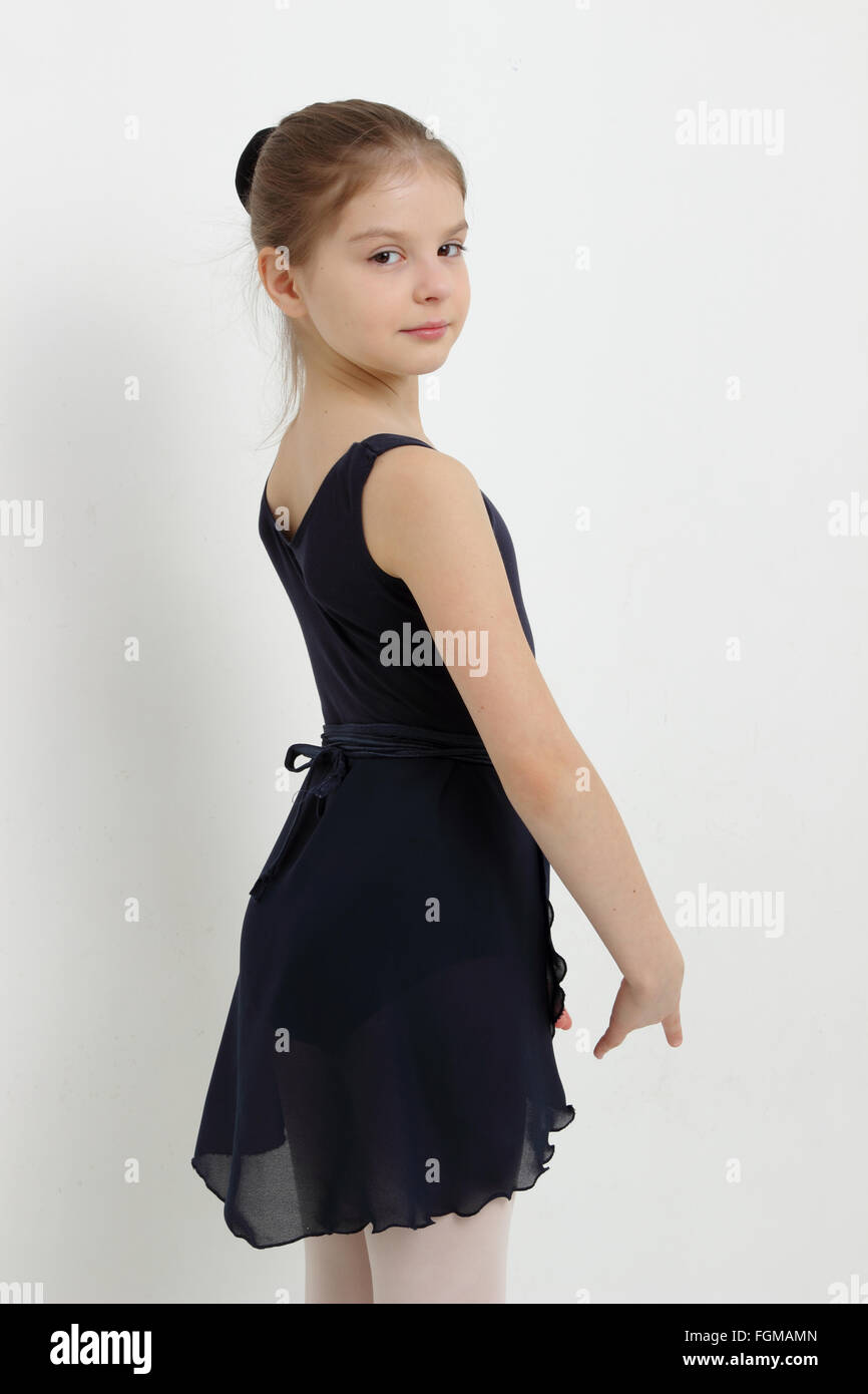 Beautiful caucasian young ballerina is posing on camera Stock Photo