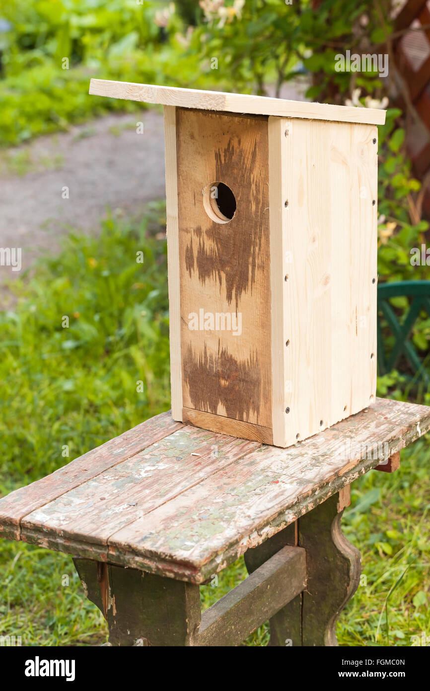 Unfinished new homemade birdhouse made of wood Stock Photo