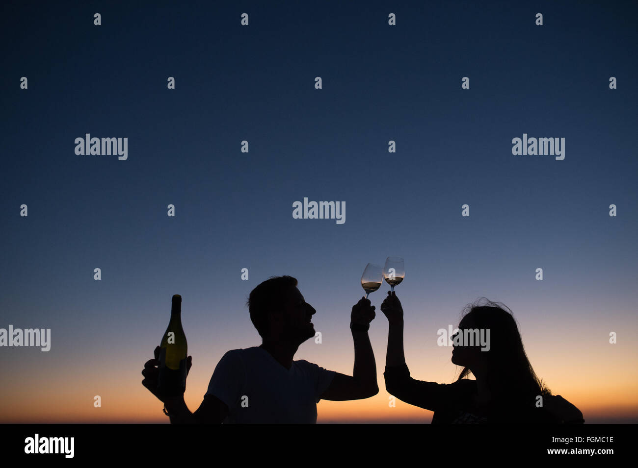 Silhouette couple drinking wine sunset hi-res stock photography and ...
