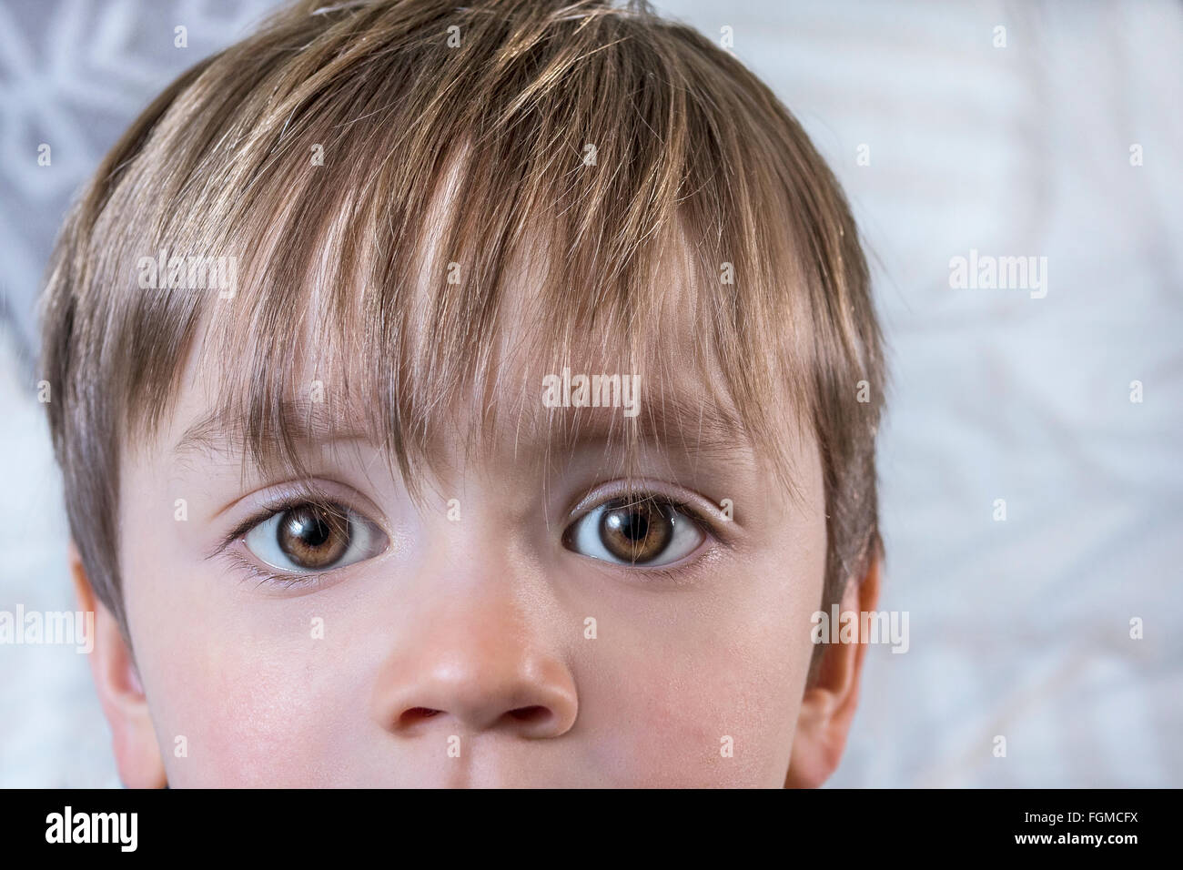 Close up of a cute kid with big eyes Stock Photo