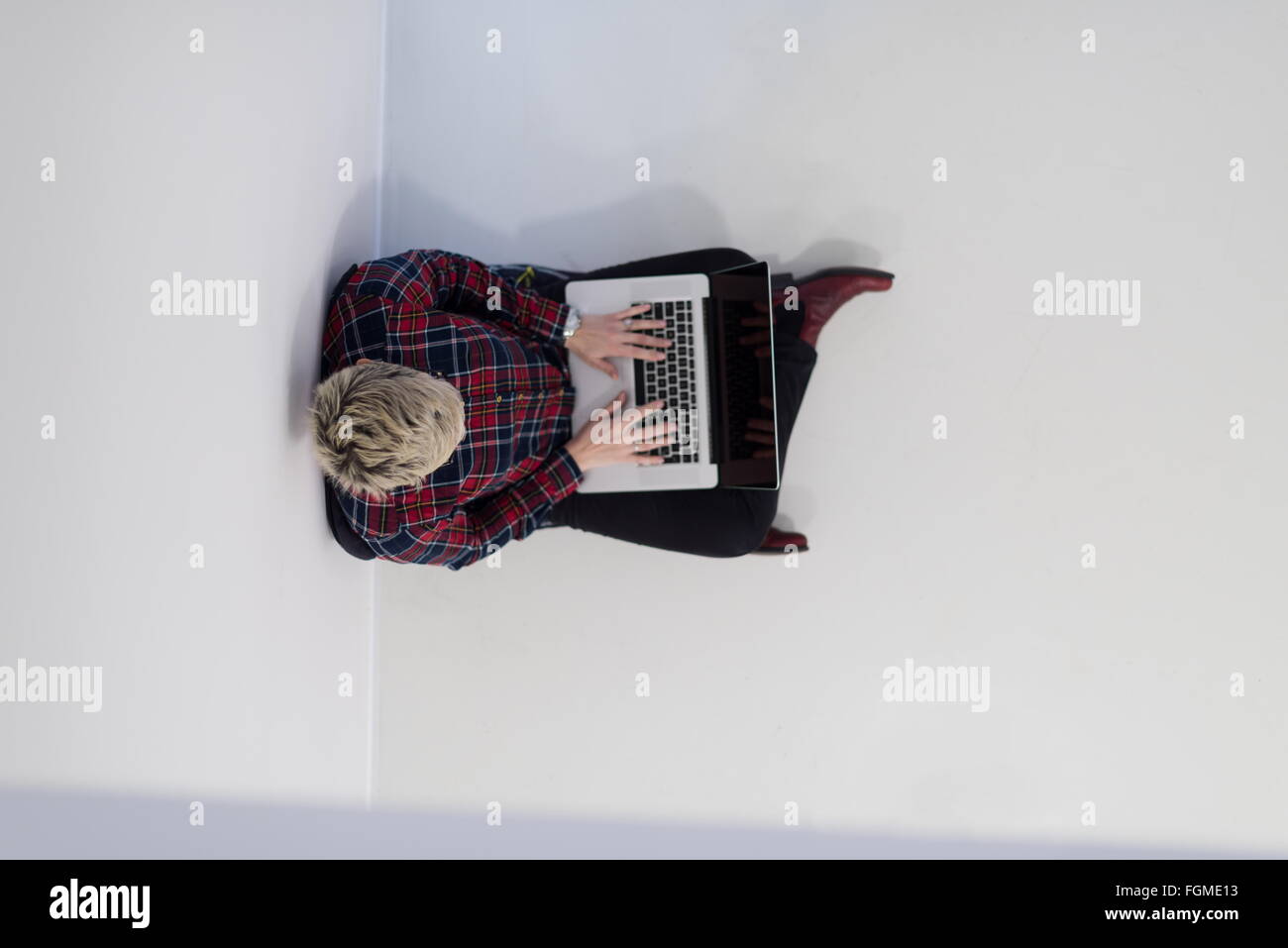 top view of young business woman working on laptop computer in modern ...