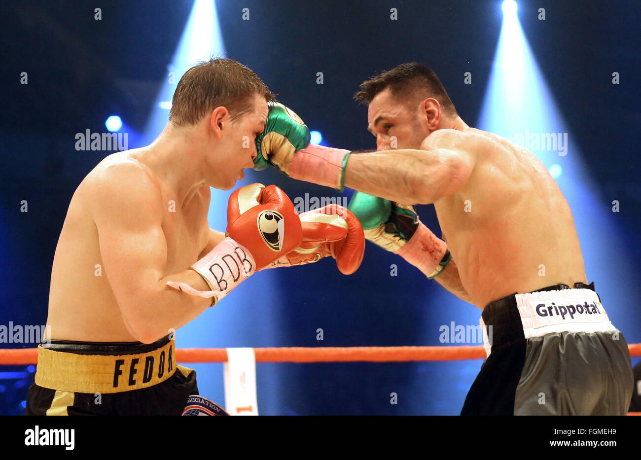Oberhausen, Germany. 20th Feb, 2016. Feder Chudinov (Russia, l) in action against Felix Sturm (Germany, r) during the Super Middleweight fight at the WBA Super World Cup in Oberhausen, Germany, 20 February 2016. Felix Sturm wins back the Super Middleweight World Champion title. Photo: Roland Weihrauch/dpa/Alamy Live News Stock Photo