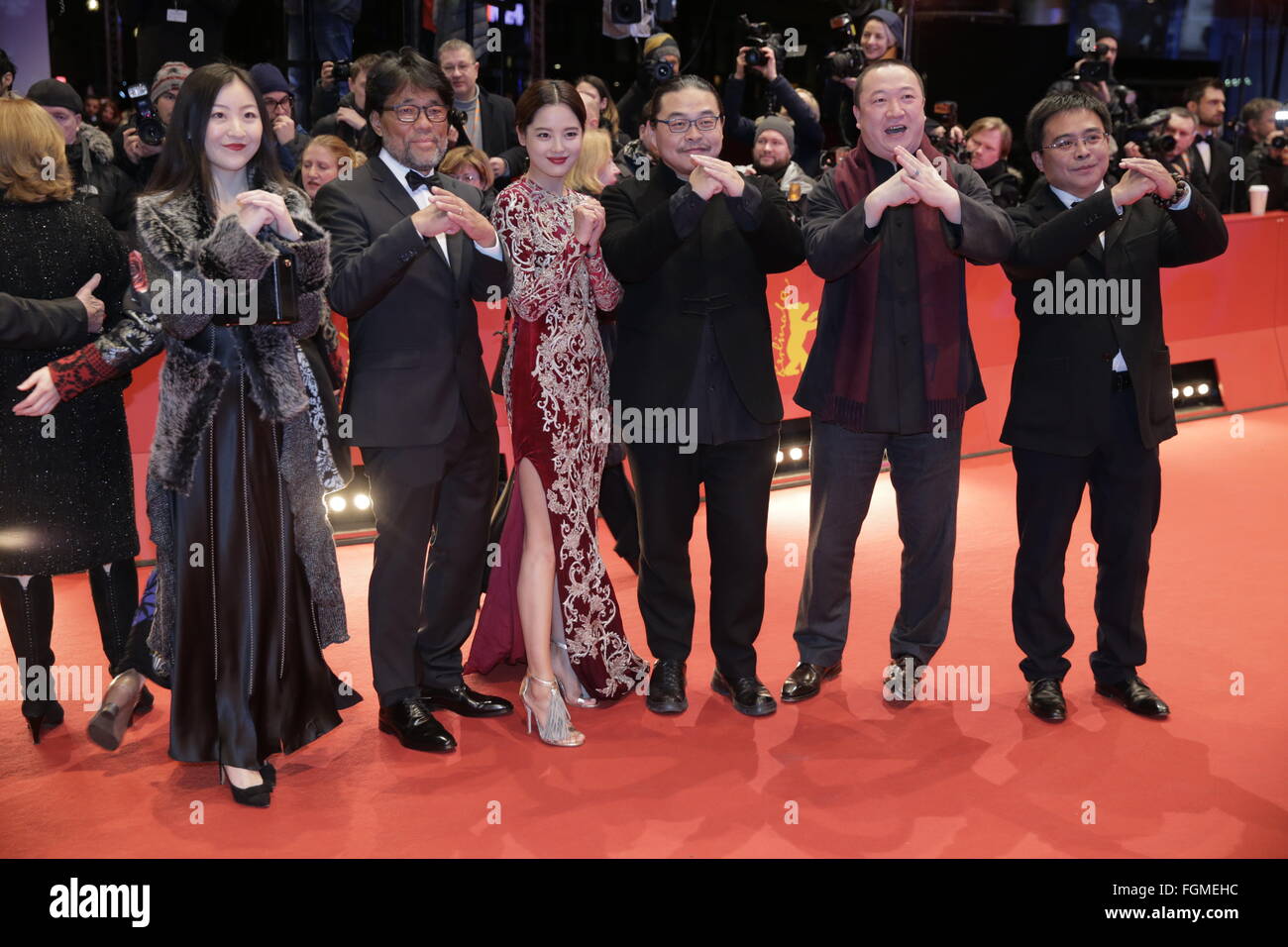 Berlin, Germany. 20th Feb, 2016. 66th International Film Festival in Berlin, Germany, 20 February 2016. Closing and award ceremony: Members of the cast of 'Chang Jiang Tu' with cinematographer Mark Lee Ping-Bing (2nd l), Xin Zhi Lei (3rd l), director Yang Chao, producer Wang Yu and non-identified person (r). The Berlinale runs from 11 February to 21 February 2016. Photo: JENS KALAENE/dpa/Alamy Live News Stock Photo