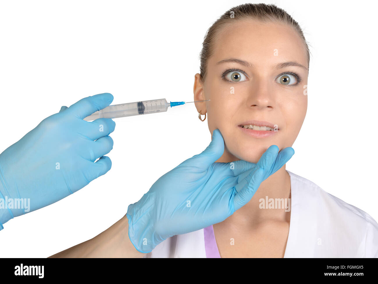 Young beautiful girl getting Botox injection from a syringe Stock Photo