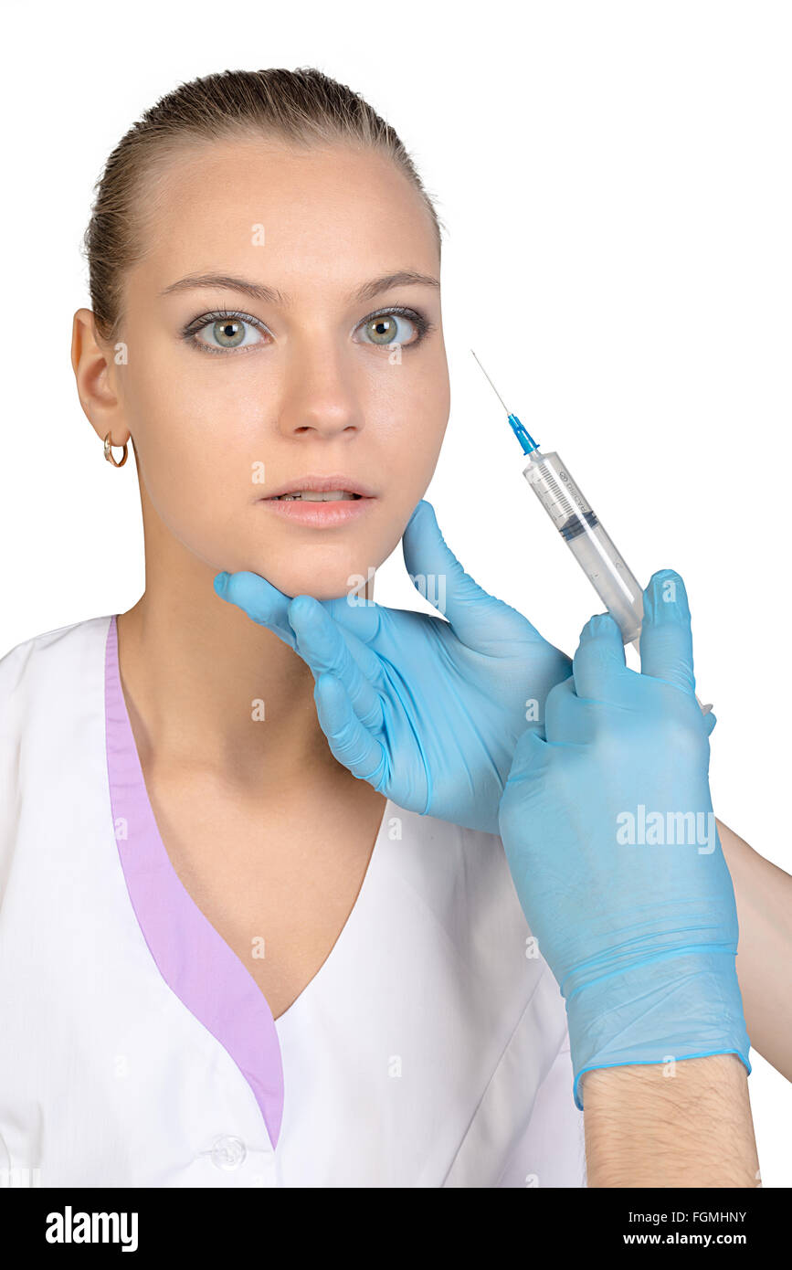 Young beautiful girl getting Botox injection from a syringe Stock Photo