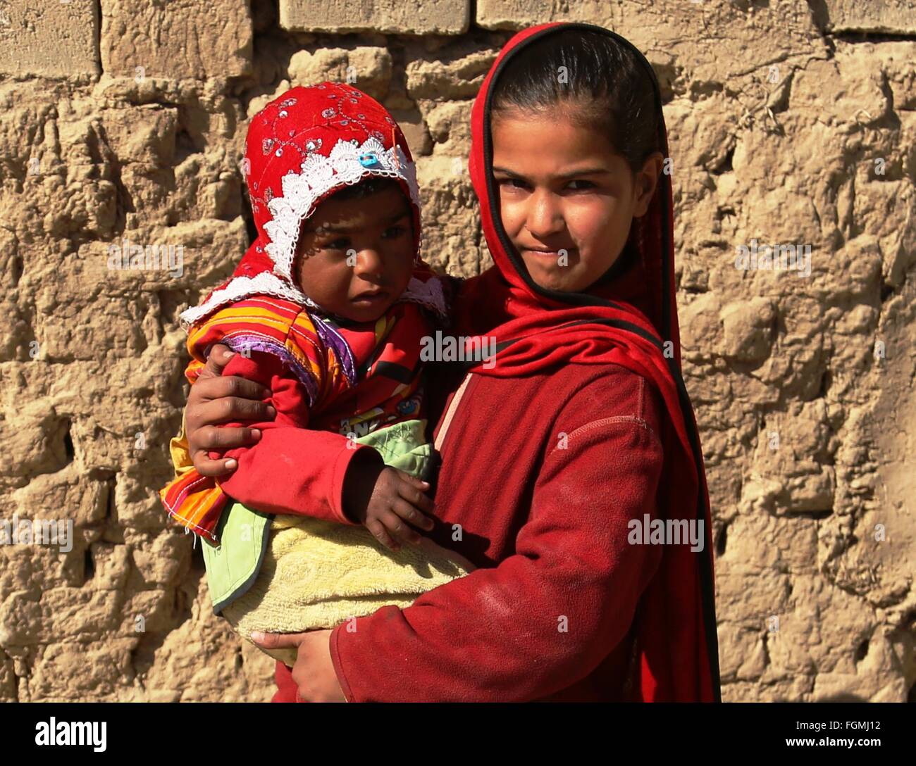 Kabul, Afghanistan. 21st Feb, 2016. An Afghan displaced girl holds her ...