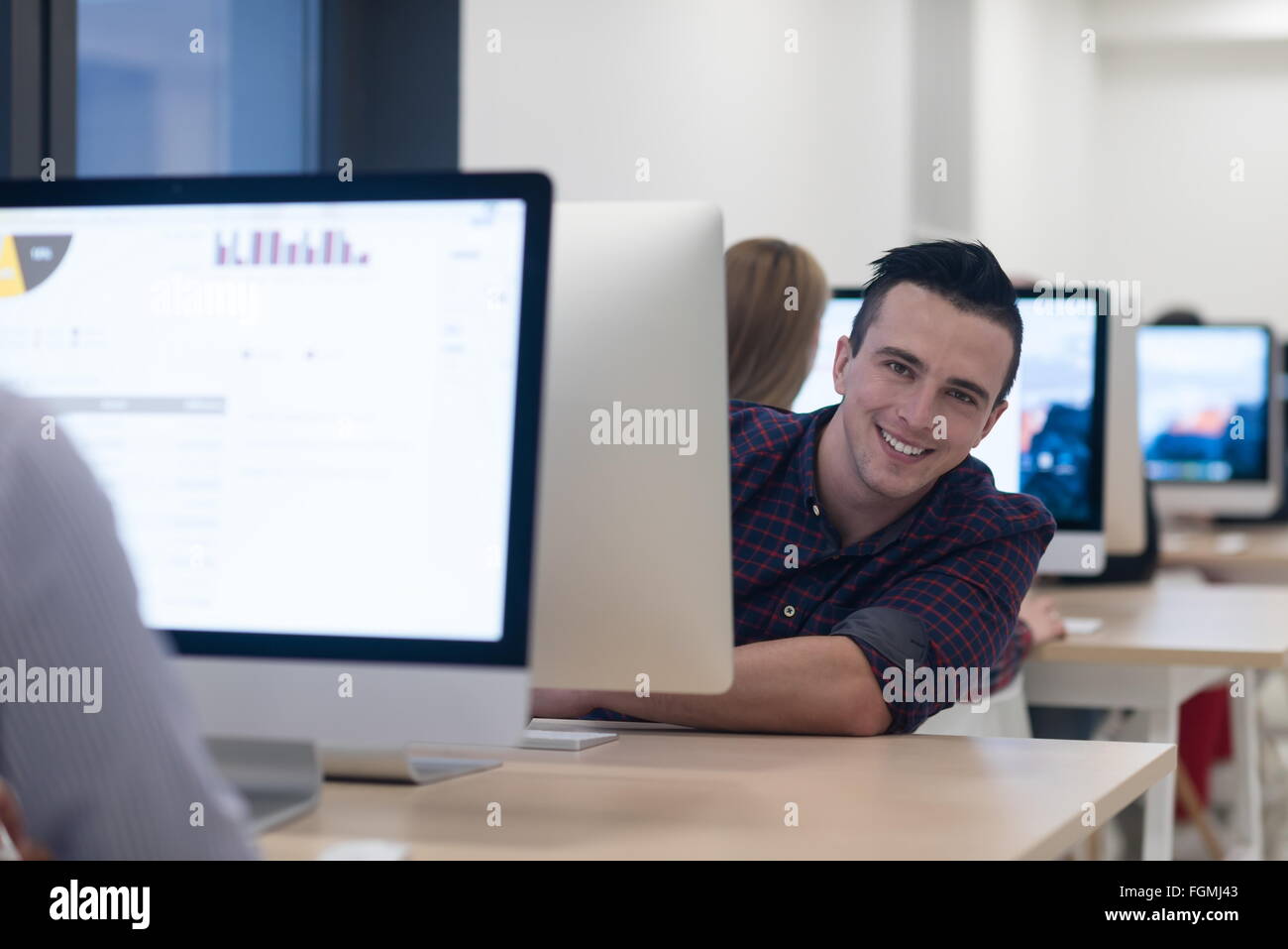 startup business, software developer working on desktop computer at ...